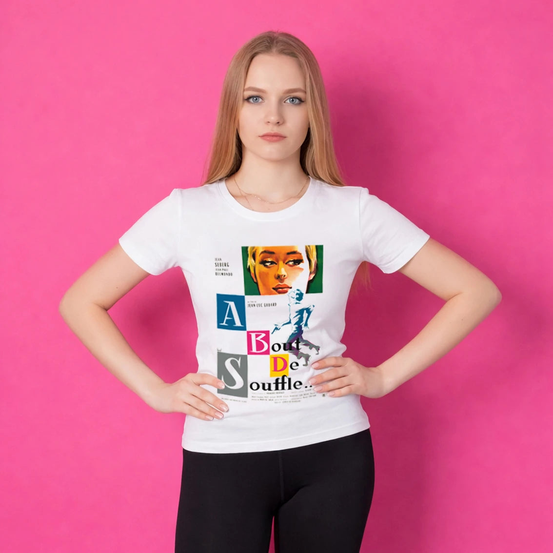 Woman wearing a white t-shirt with colourful design and 'Γ Bout De Souffle' text on a pink background