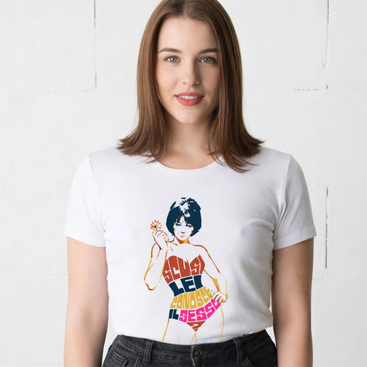 Woman wearing a white t-shirt with a colorful graphic design of a woman and 'Scusi Lei Conosce Il Sesso' text on a white background