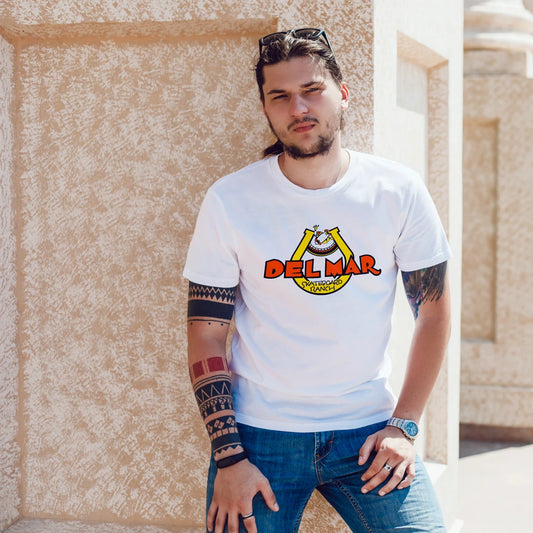 Man wearing a white t-shirt with 'Del Mar' logo against a beige wall.