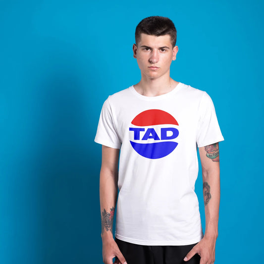 Man wearing a white t-shirt with a logo and 'TAD' text on a blue background