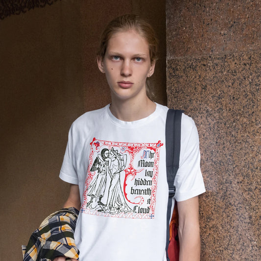 Woman wearing a white t-shirt with a graphic design and 'The Moon Lay Hidden Beneath A Cloud' text against a textured wall.
