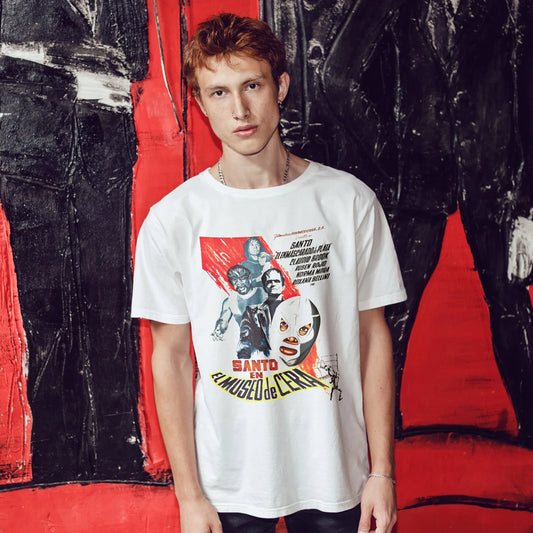 Man wearing a white t-shirt with graphic design  and 'Santo In The Wax Museum' text in front of a colorful abstract background