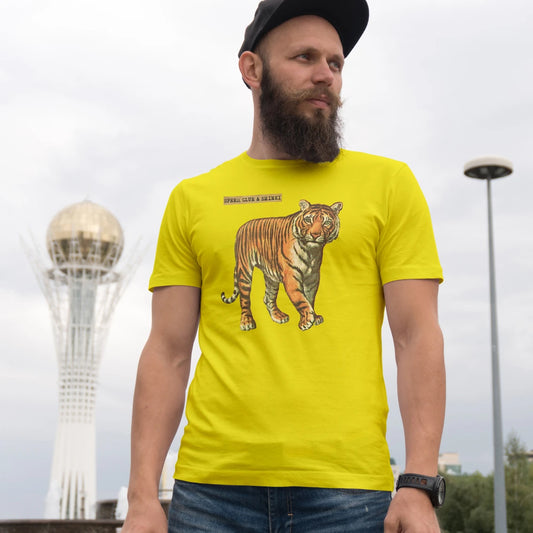 Man wearing a yellow t-shirt with a tiger graphic and 'Speed Glue & Shinki' text in an outdoor setting