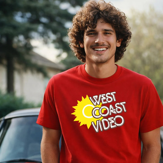 Man wearing a red 'West Coast Video' t-shirt with a yellow sun graphic.