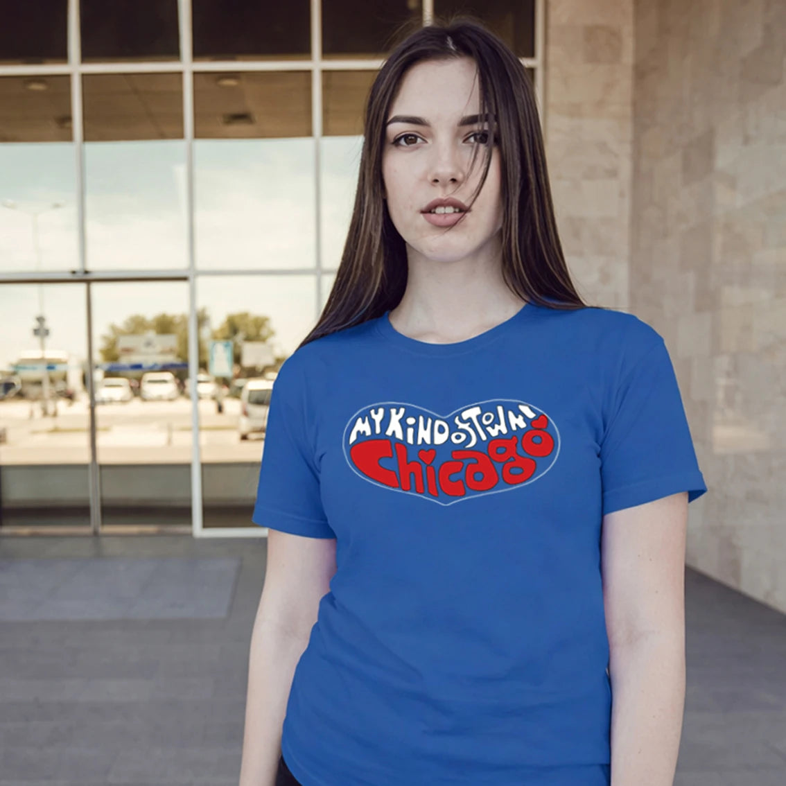 Woman wearing a blue t-shirt with 'My Kind of Town Chicago' text in an outdoor setting.