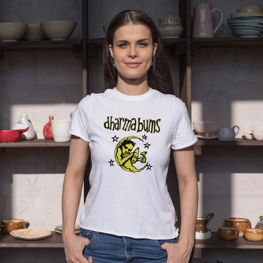 Woman wearing a white t-shirt with 'dharma bums' design in a kitchen setting