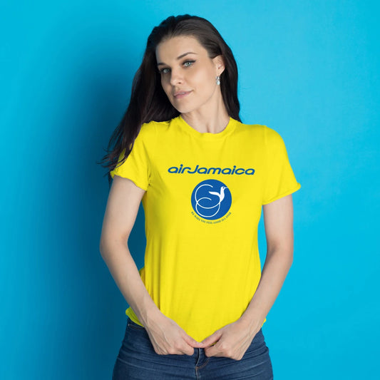 Woman wearing a yellow 'air Jamaica' t-shirt against a blue background
