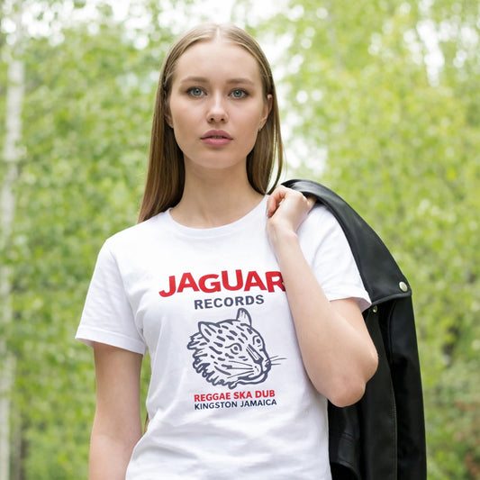 Woman wearing a white t-shirt with Jaguar Records branding outdoors