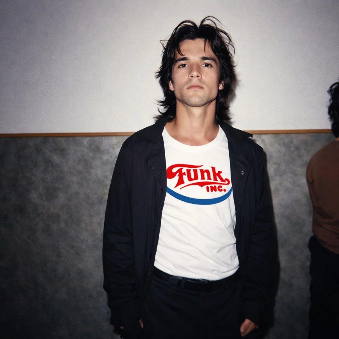 Man wearing a white t-shirt with 'Funk Inc.' logo against a plain background